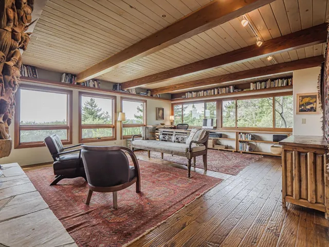 a kitchen with granite countertop wooden floors and stainless steel appliances