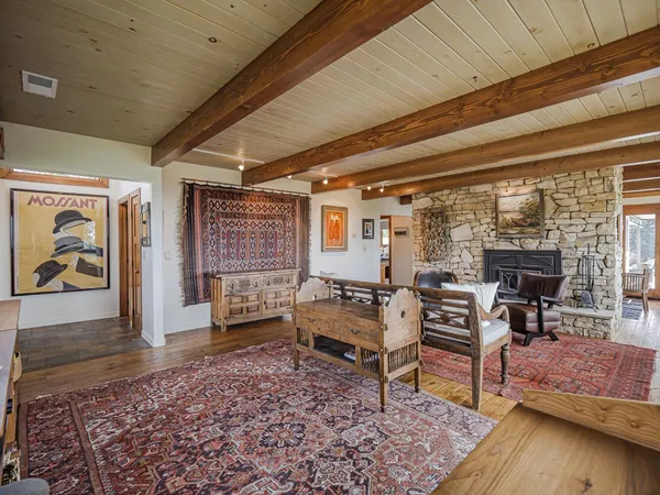 a bedroom with a bed window and a table