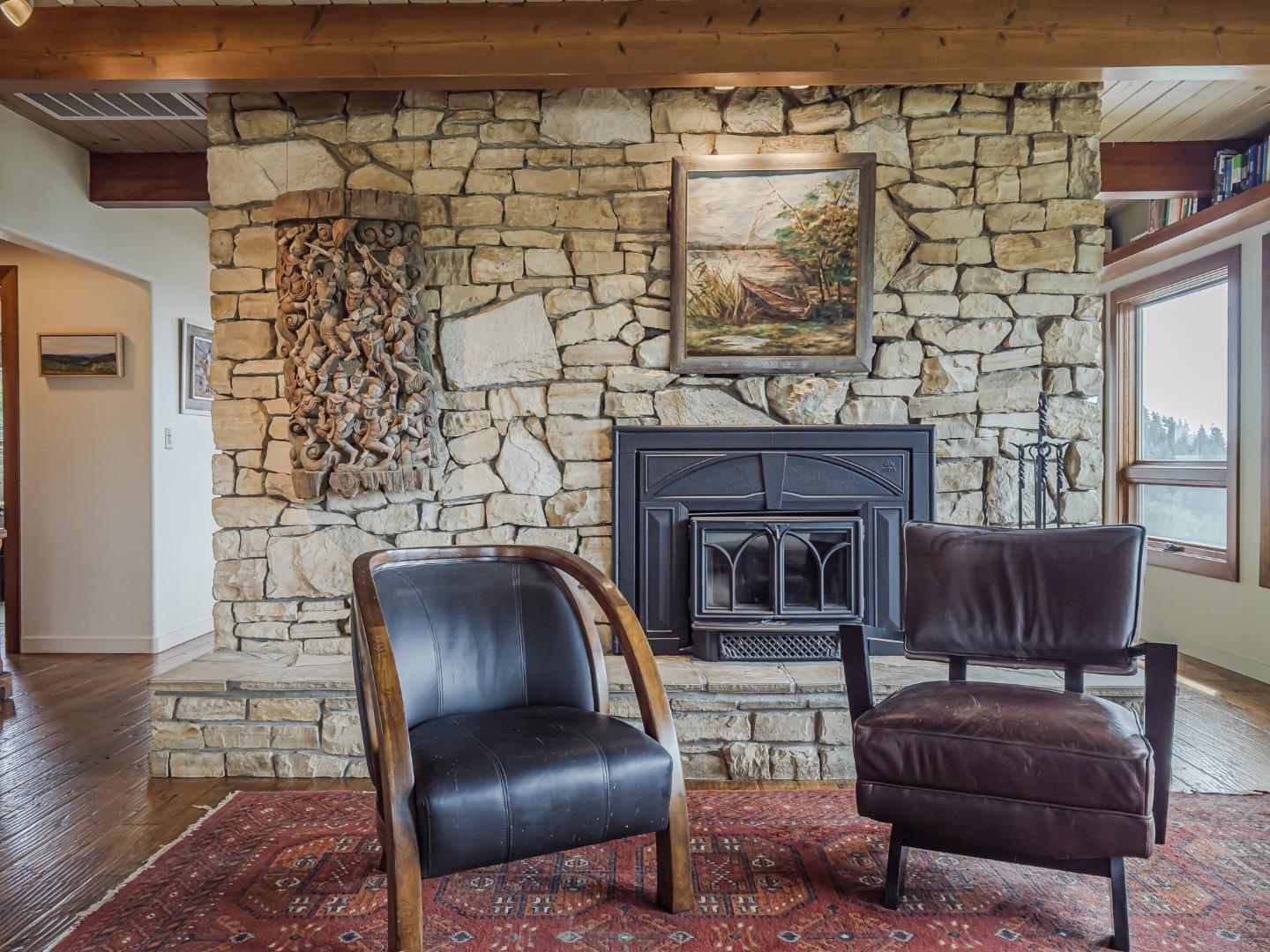 1584 Tindall Ranch Road Corralitos, CA 95076 - Photo 15 of 104 a living room with furniture and a fireplace