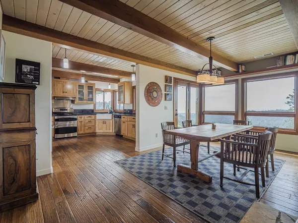 a kitchen with stainless steel appliances granite countertop a sink and cabinets