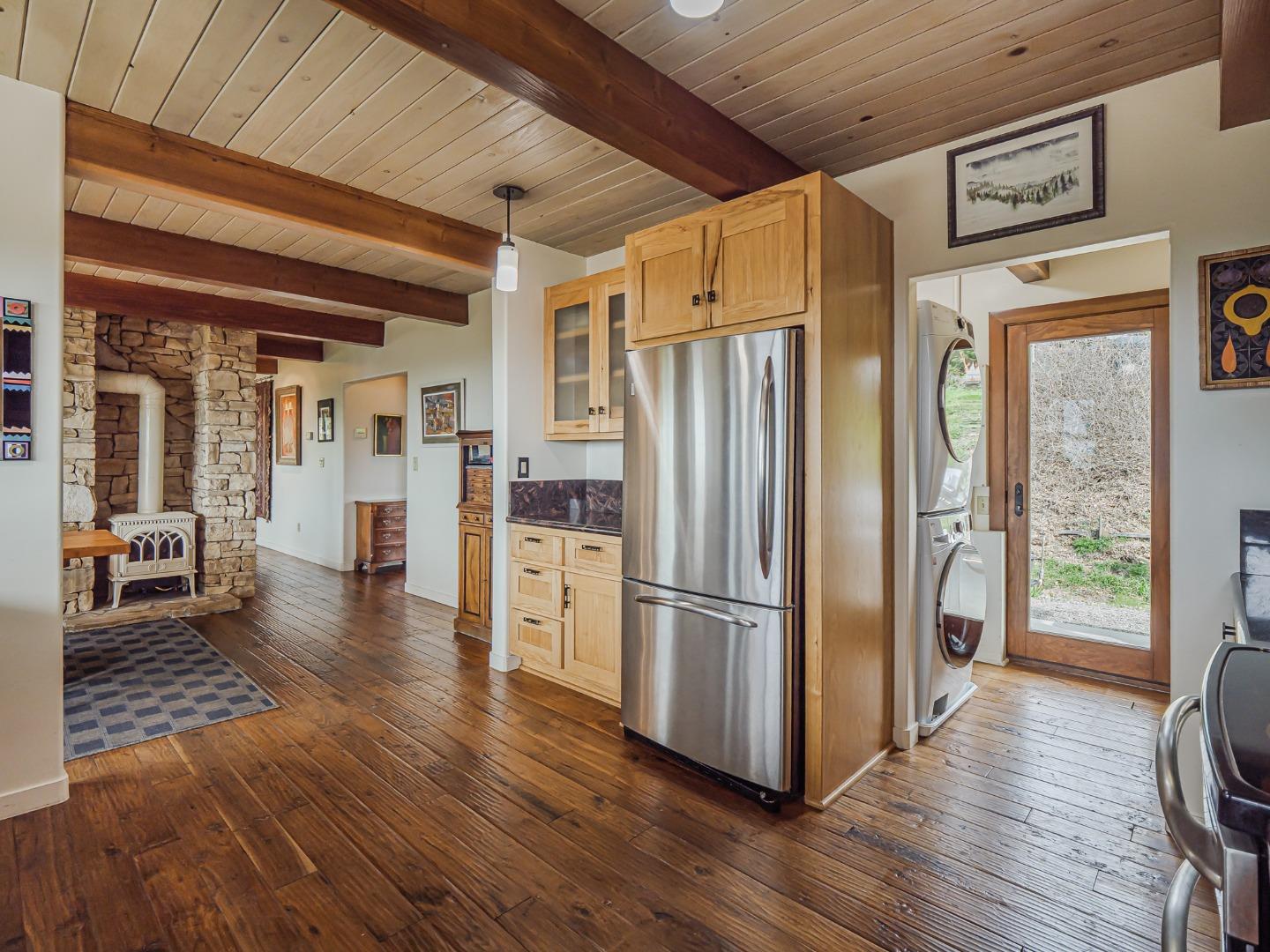 1584 Tindall Ranch Road Corralitos, CA 95076 - Photo 22 of 104 a kitchen with stainless steel appliances a refrigerator and wooden floor