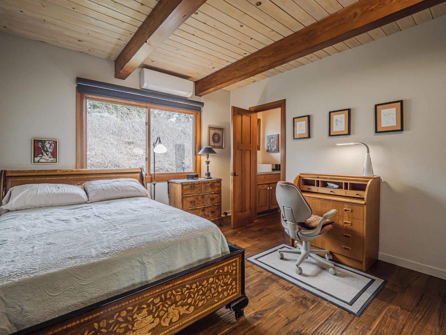 1584 Tindall Ranch Road Corralitos, CA 95076 - Photo 26 of 104 a bedroom with a bed window and a table