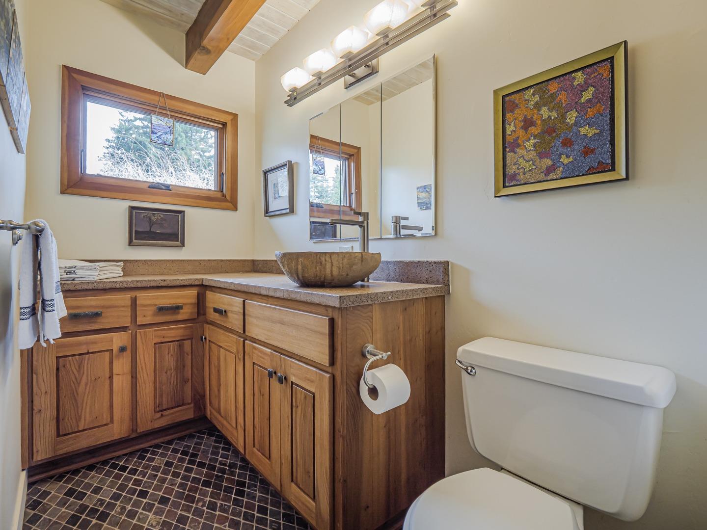 1584 Tindall Ranch Road Corralitos, CA 95076 - Photo 28 of 104 a bathroom with a toilet a sink and a shower