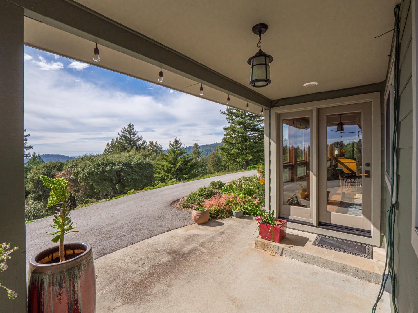 1584 Tindall Ranch Road Corralitos, CA 95076 - Photo 42 of 104 a front view of a house with a porch