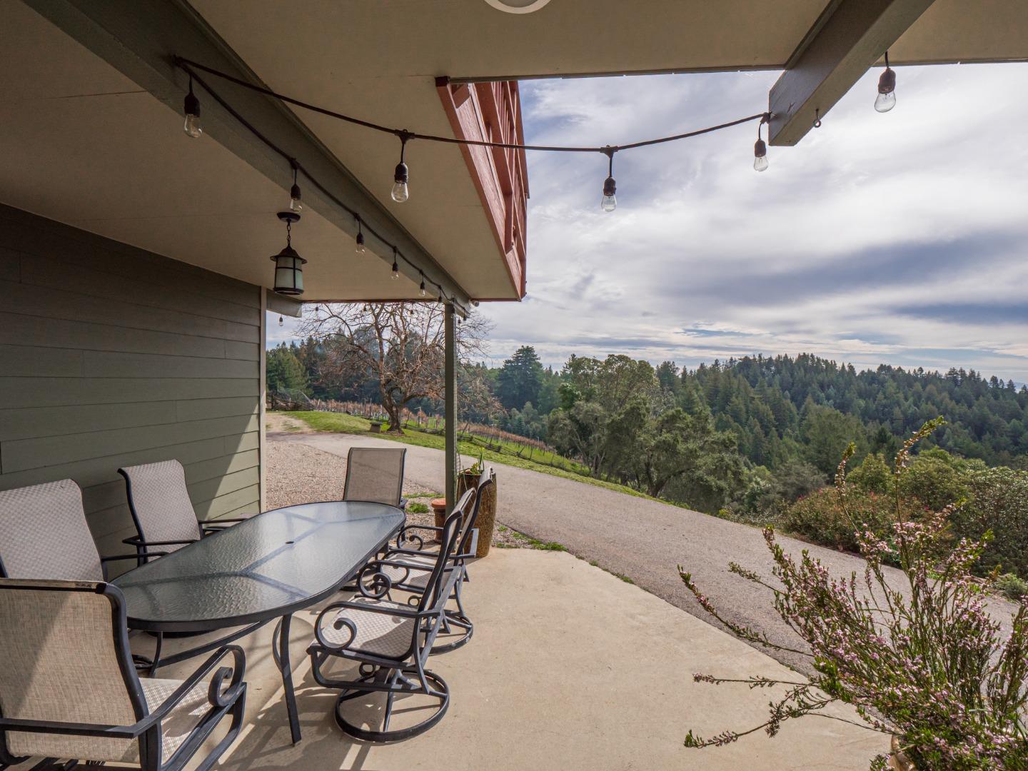 1584 Tindall Ranch Road Corralitos, CA 95076 - Photo 45 of 104 a view of a patio with a table chairs and a table