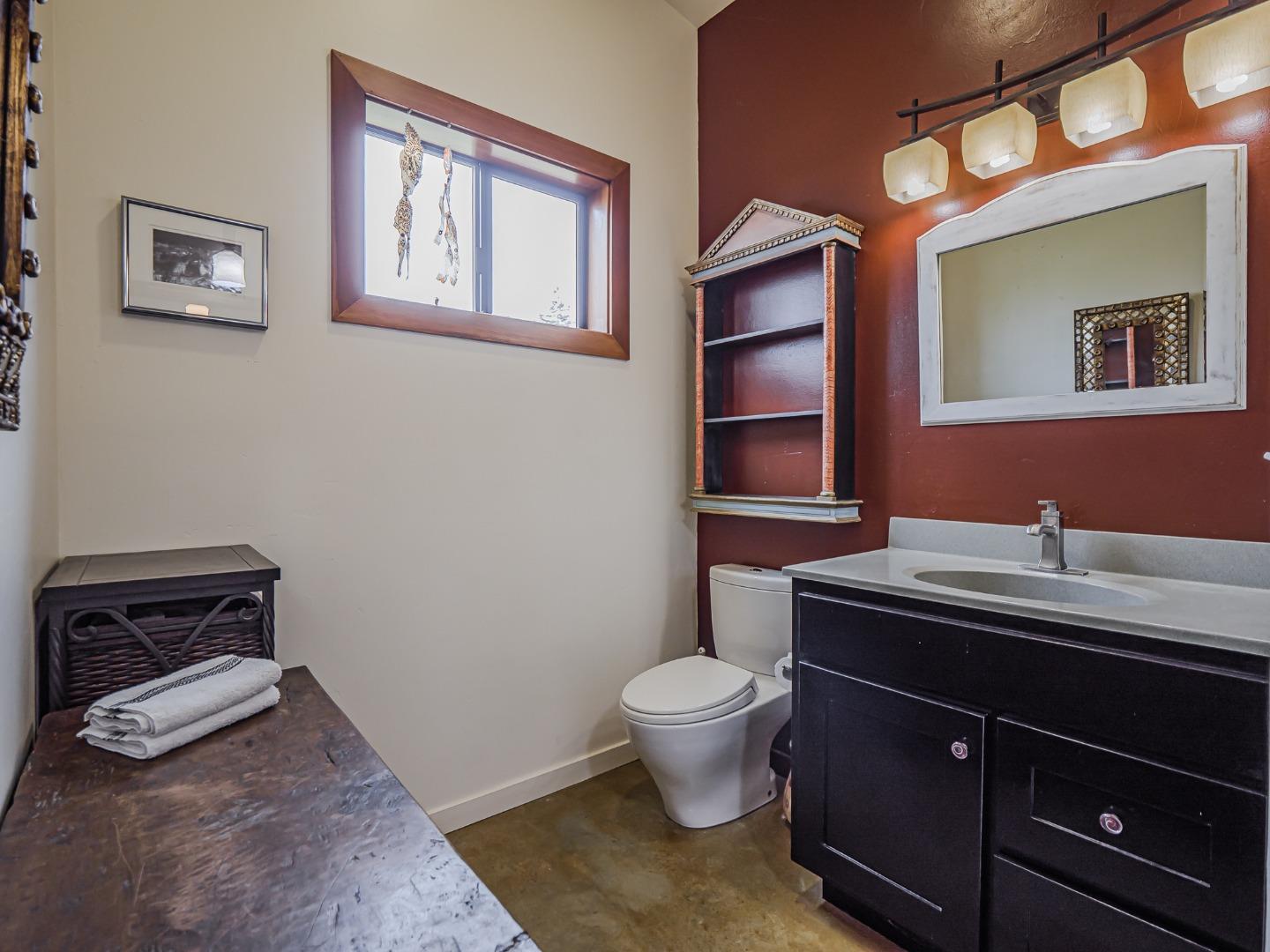 1584 Tindall Ranch Road Corralitos, CA 95076 - Photo 74 of 104 a room with a chair and cabinets