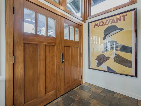 a dining room with furniture and wooden floor