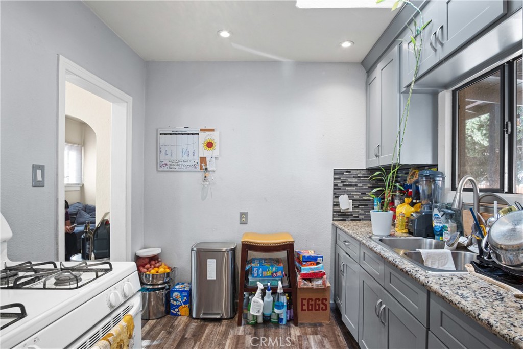 3420 Comer Avenue Riverside, CA 92507 - Photo 17 of 26 a view of a kitchen with fridge and workspace