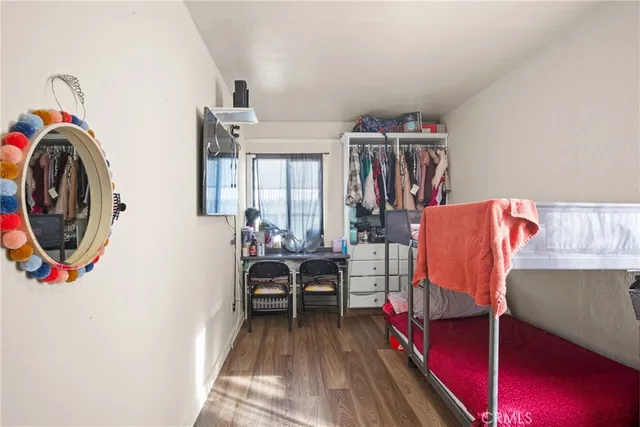 a bedroom with furniture and a window