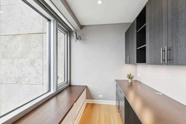 a bedroom with furniture and a flat screen tv