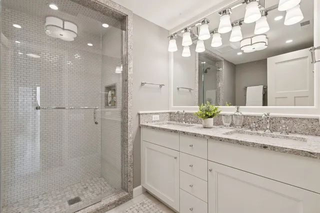 a white toilet sitting next to a bathroom sink