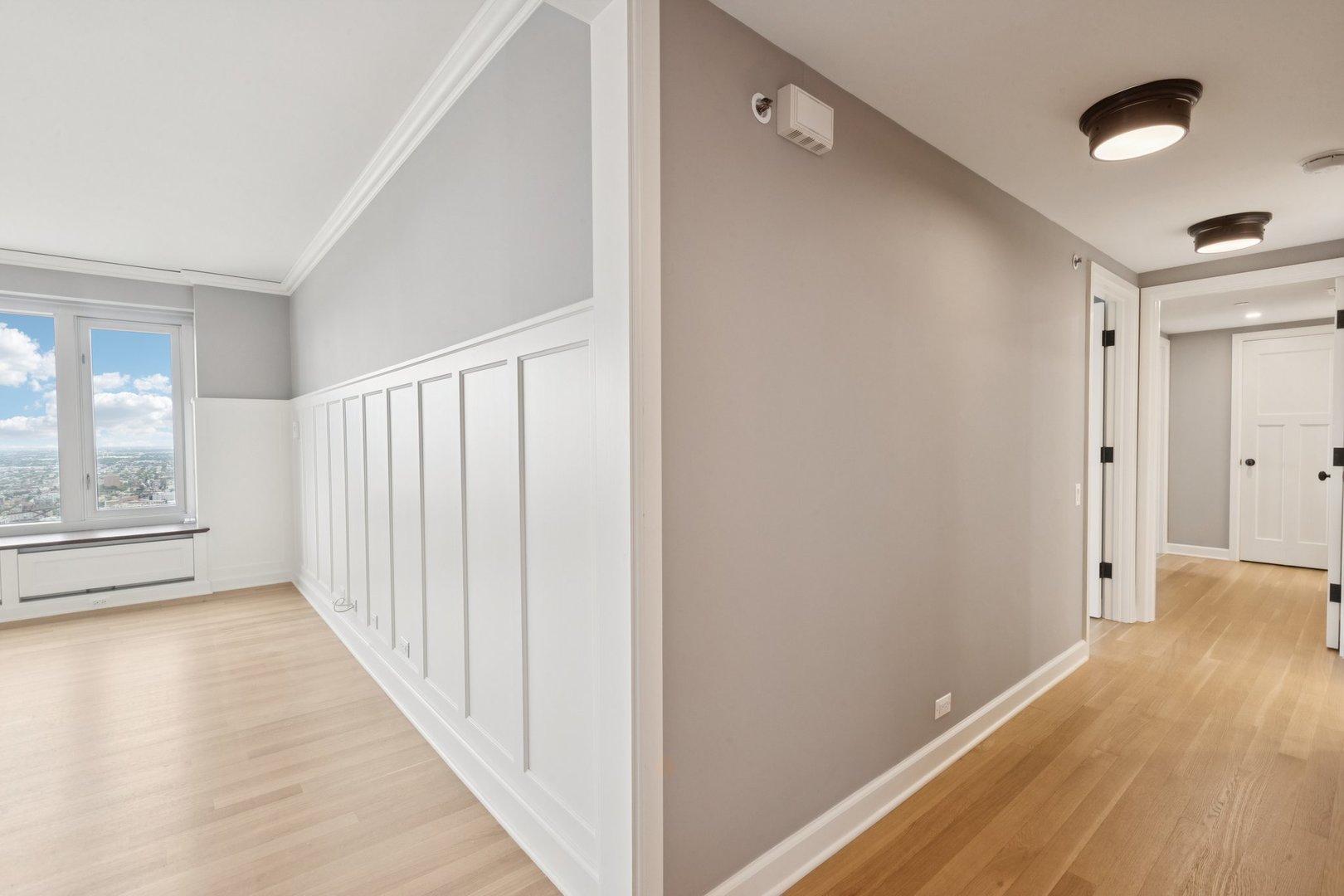 132 East Delaware Place, Unit 4803 Chicago, IL 60611 - Photo 45 of 54 a view of a hallway with wooden floor and staircase