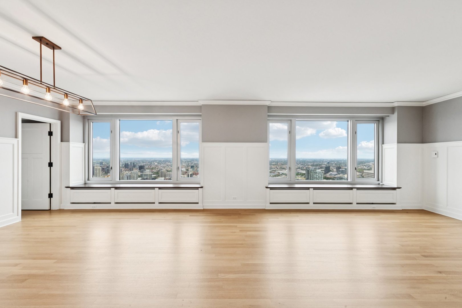 132 East Delaware Place, Unit 4803 Chicago, IL 60611 - Photo 8 of 53 a view of empty room with wooden floor and fan
