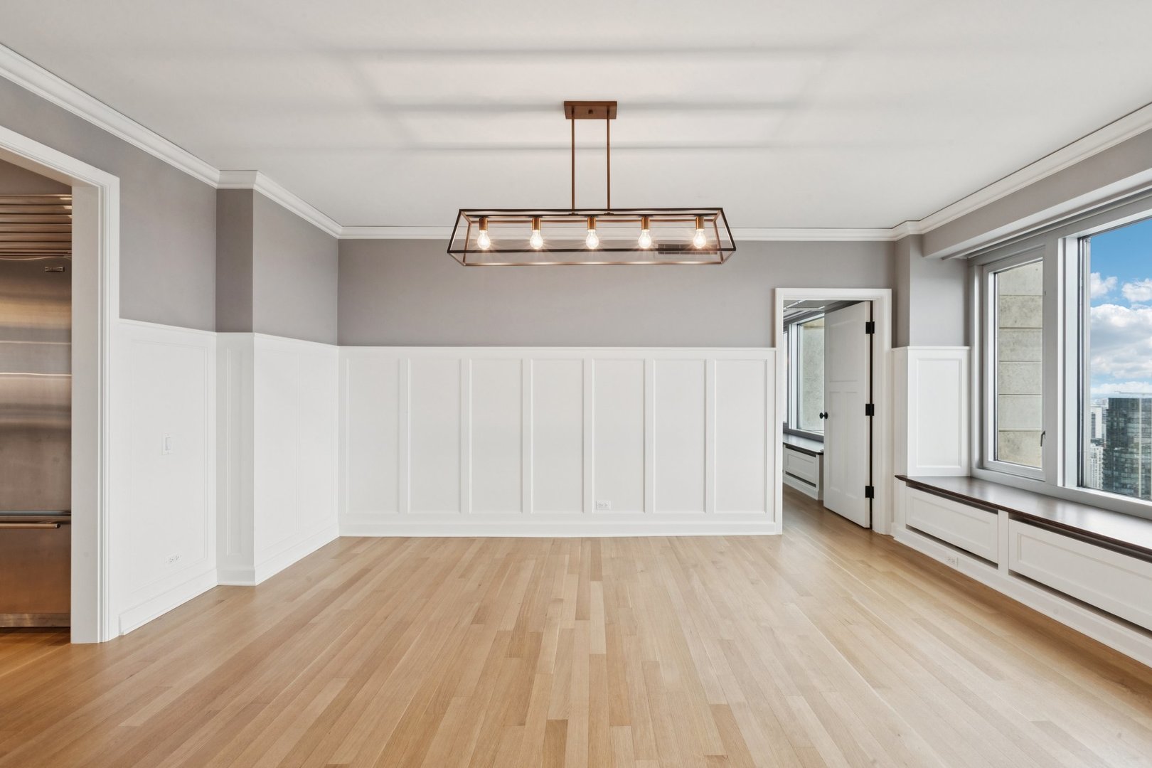 132 East Delaware Place, Unit 4803 Chicago, IL 60611 - Photo 9 of 53 a view of a room with wooden floor stairs and a window