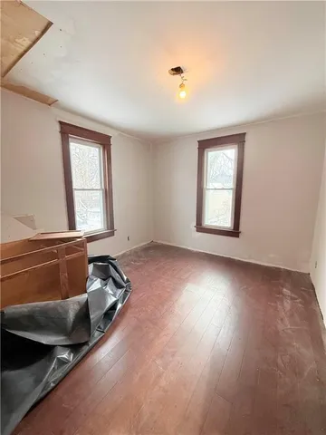 a room with gym equipment and a window