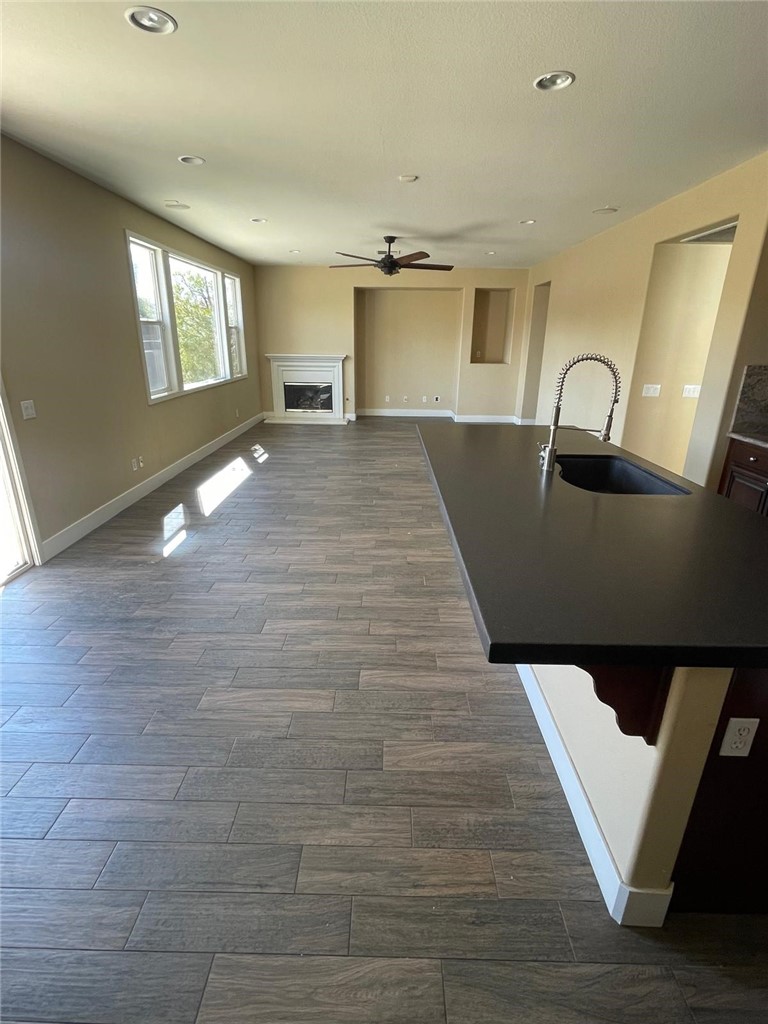 32689 Cottonwood Road Winchester, CA 92596 - Photo 20 of 25 a view of an empty room with window and wooden floor
