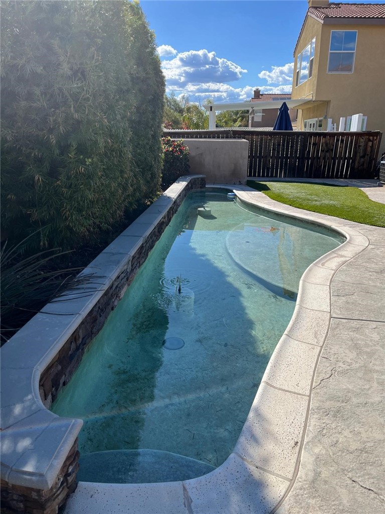 32689 Cottonwood Road Winchester, CA 92596 - Photo 3 of 25 a view of a swimming pool with a yard