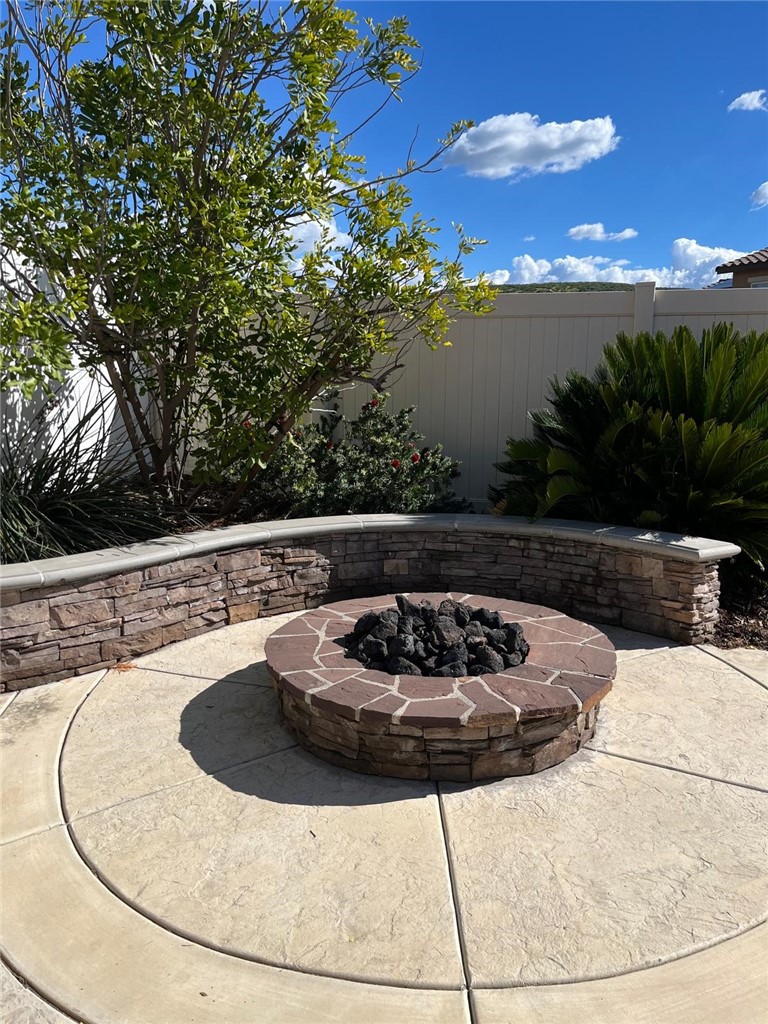 32689 Cottonwood Road Winchester, CA 92596 - Photo 4 of 25 a view of a swimming pool with an outdoor seating