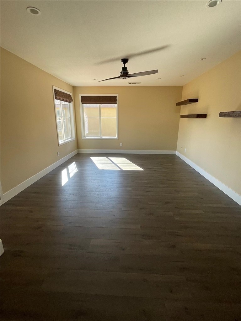32689 Cottonwood Road Winchester, CA 92596 - Photo 5 of 25 a view of empty room with wooden floor and fan