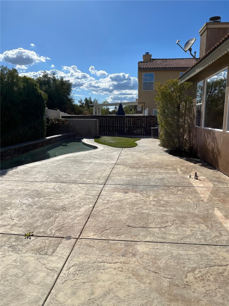32689 Cottonwood Road Winchester, CA 92596 - Photo 6 of 25 a view of a terrace with a garden