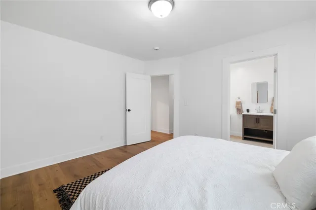 a bedroom with a bed and a lamp