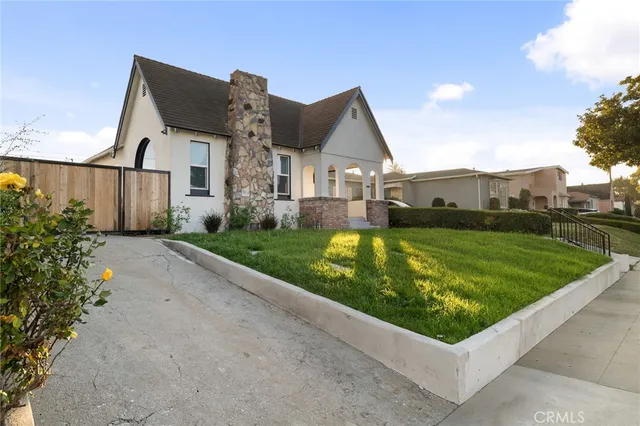 a front view of house along with green space