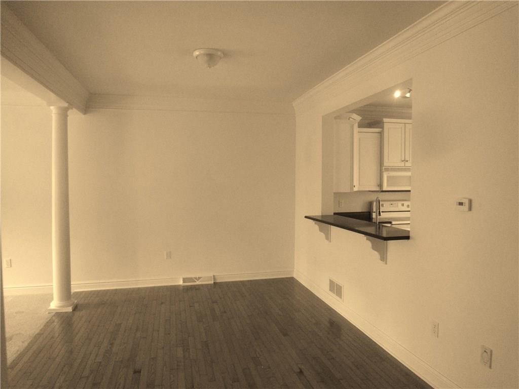 83 Shenot Road Wexford, PA 15090 - Photo 3 of 16 Generous DR has hardwood floor & pass thru quartz bar for easy entertaining.