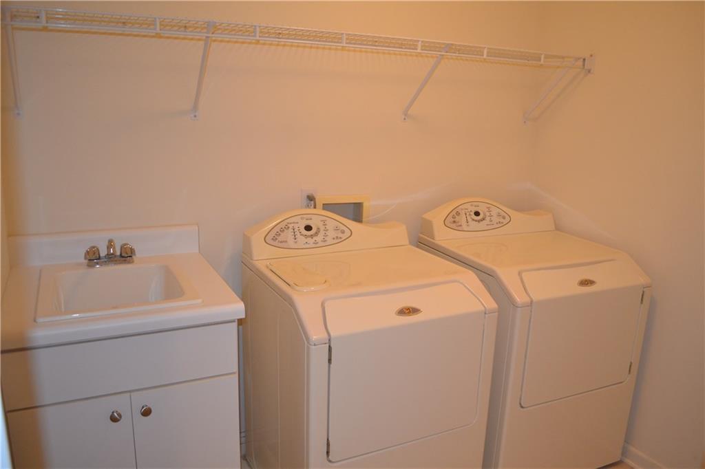 83 Shenot Road Wexford, PA 15090 - Photo 8 of 16 2nd floor laundry / sink, shelves, attic access & upscale washer & dryer.