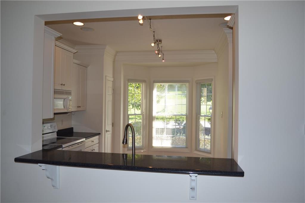 83 Shenot Road Wexford, PA 15090 - Photo 9 of 16 Pass thru bar into kitchen / bay window.