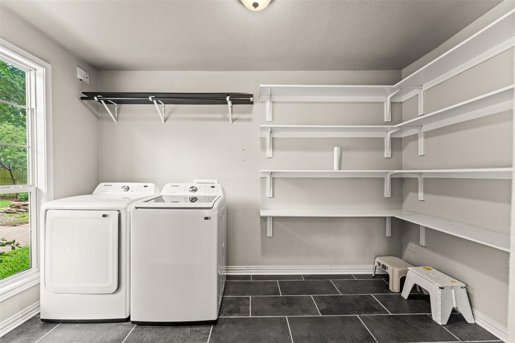 3116 Alexander Avenue Waco, TX 76708 - Photo 29 of 40 a utility room with cabinets dryer and washer