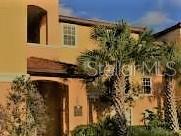 5463 Vineland Road, Unit 5210 Orlando, FL 32811 - Photo 1 of 1 view of a house with a tree
