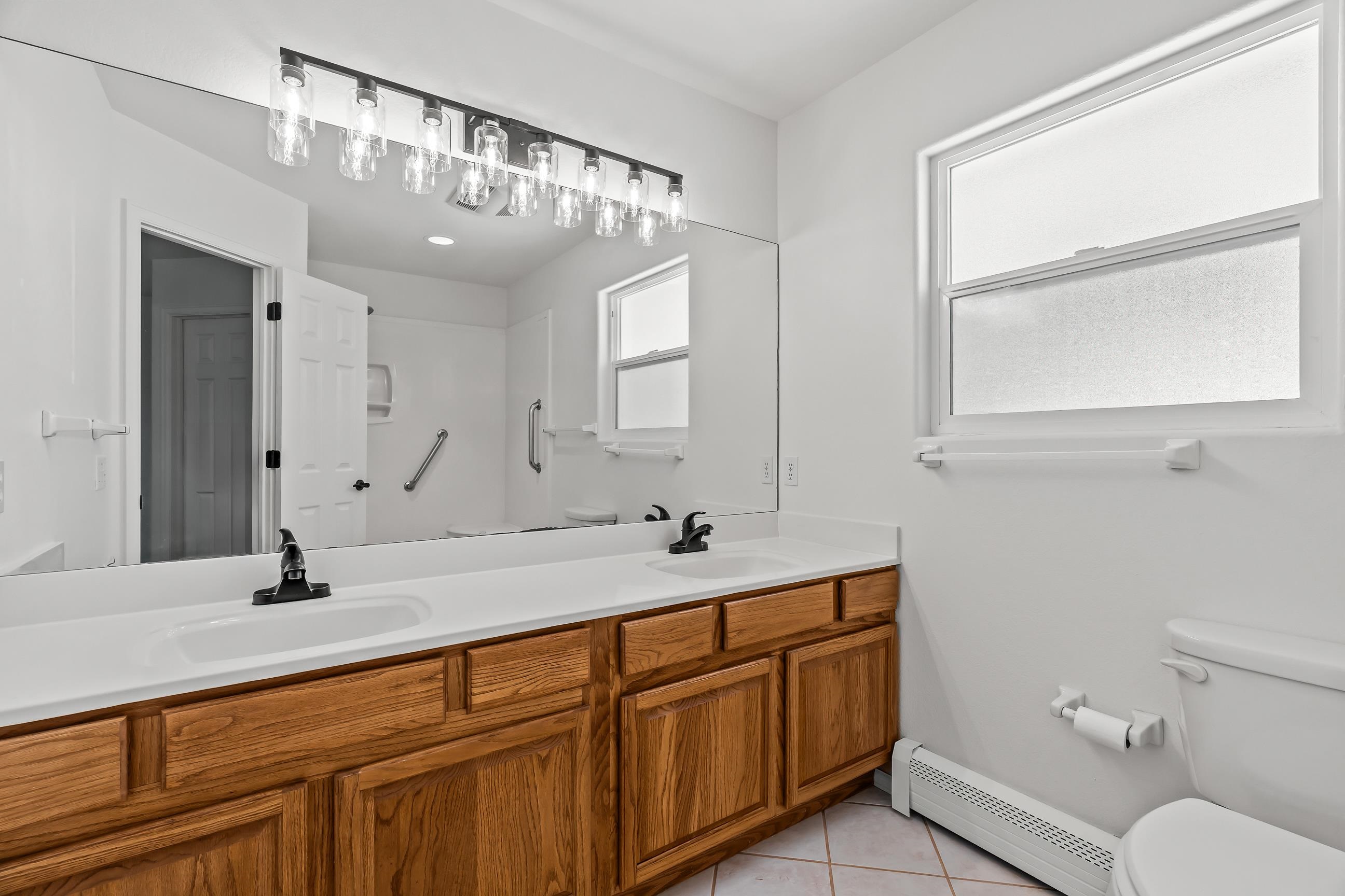 705-24 24 3/4 Road Grand Junction, CO 81505 - Photo 11 of 27 a bathroom with a double vanity sink and a mirror