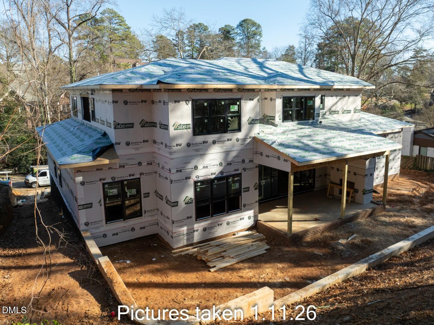 3521 Brook Drive Raleigh, NC 27609 - Photo 3 of 13 a view of a white house with a sink and outdoor kitchen