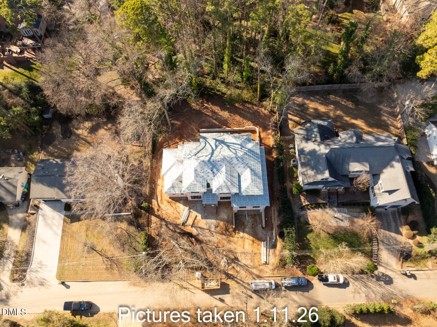 3521 Brook Drive Raleigh, NC 27609 - Photo 7 of 13 a backyard of a house with table and chairs