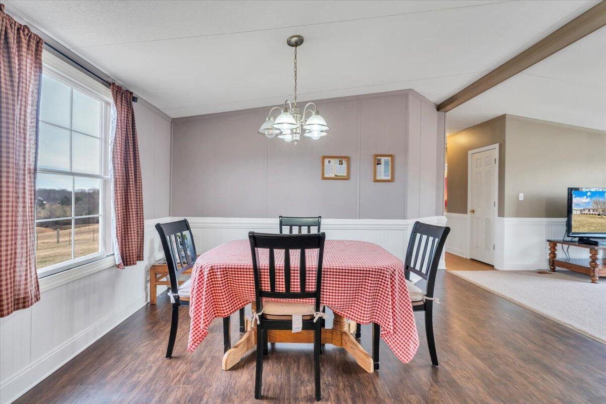 627-641 Novelty Road Penhook, VA 24137 - Photo 11 of 64 a view of a dining room with furniture window and wooden floor