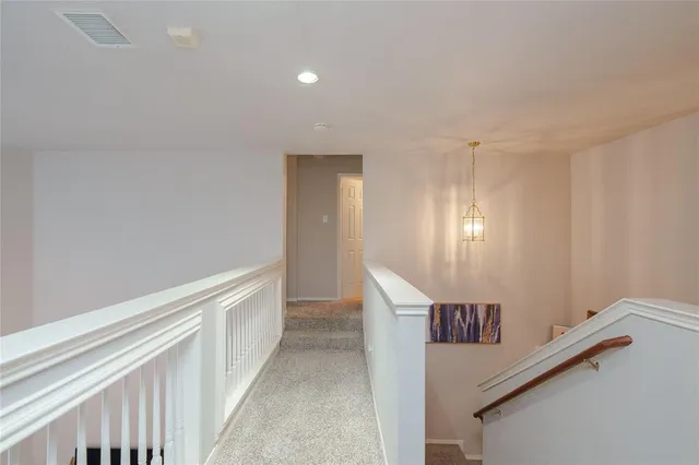 a view of a hallway with entryway