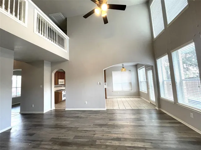 a view of an entryway with wooden floor