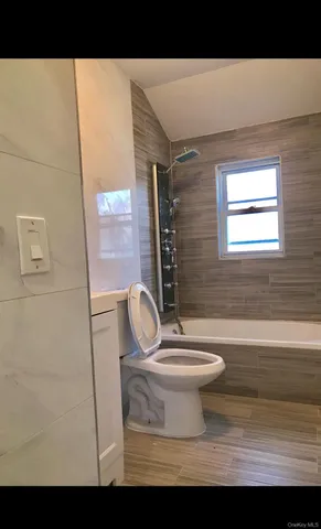 a bathroom with a toilet a sink and a bathtub