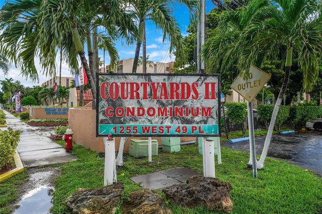 a view of a street with a building in the background