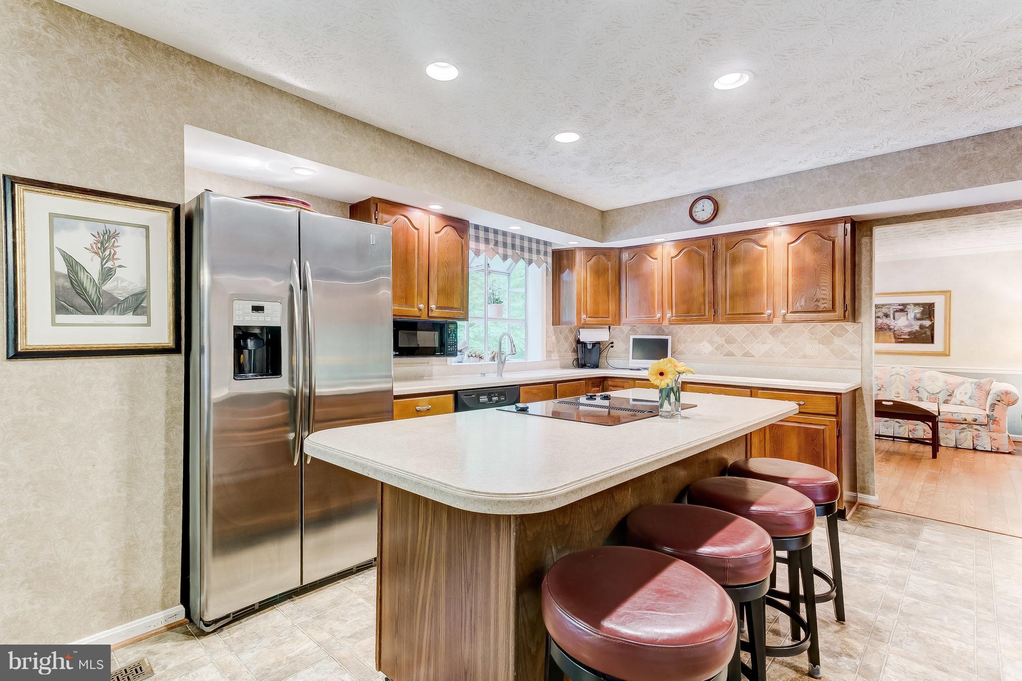 915 Stags Head Road Baltimore, MD 21286 - Photo 5 of 30 Kitchen has large island with cooktop