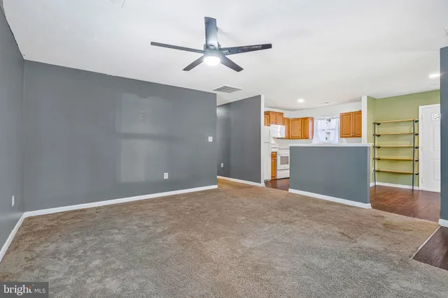 a view of a kitchen with a dishwasher and a refrigerator