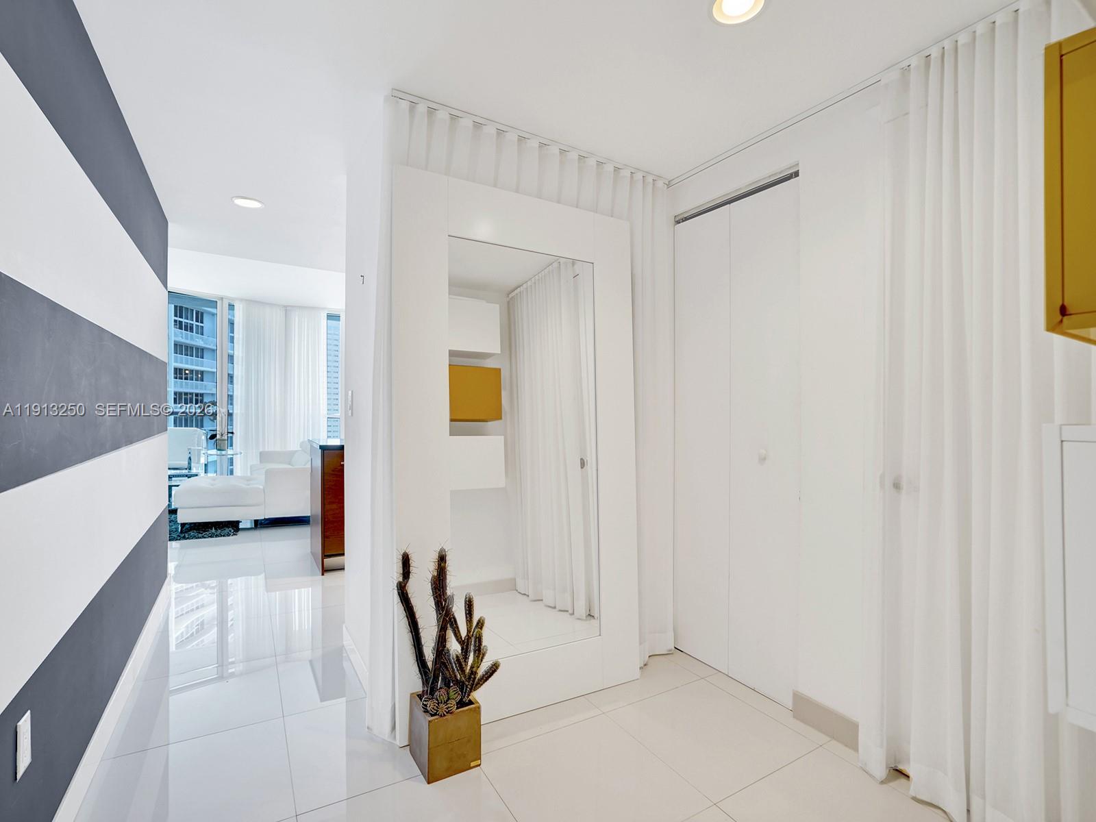 495 Brickell Avenue, Unit 2504 Miami, FL 33131 - Photo 20 of 28 a view of a hallway with painted walls