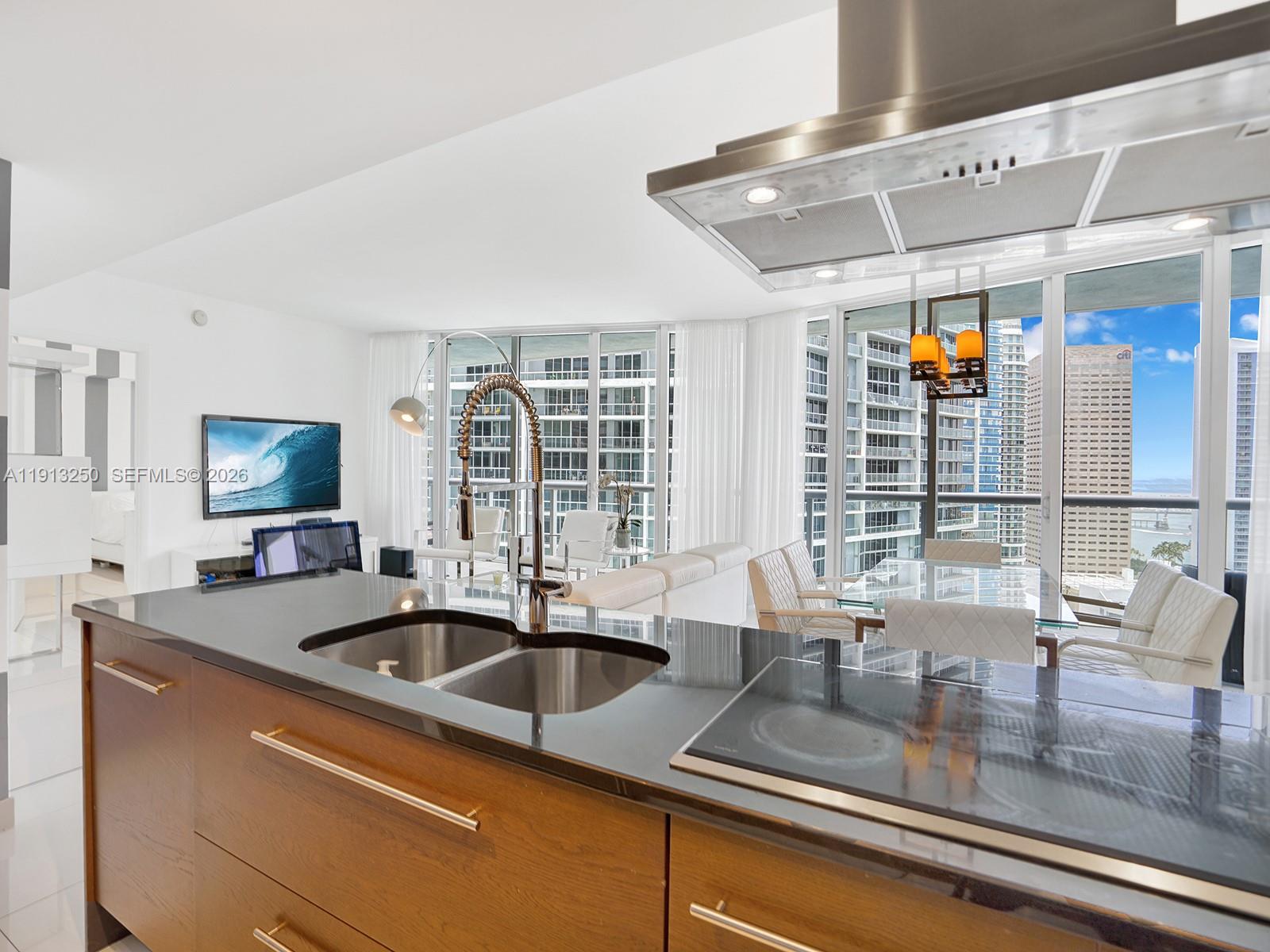 495 Brickell Avenue, Unit 2504 Miami, FL 33131 - Photo 8 of 28 a kitchen with a sink and a large window