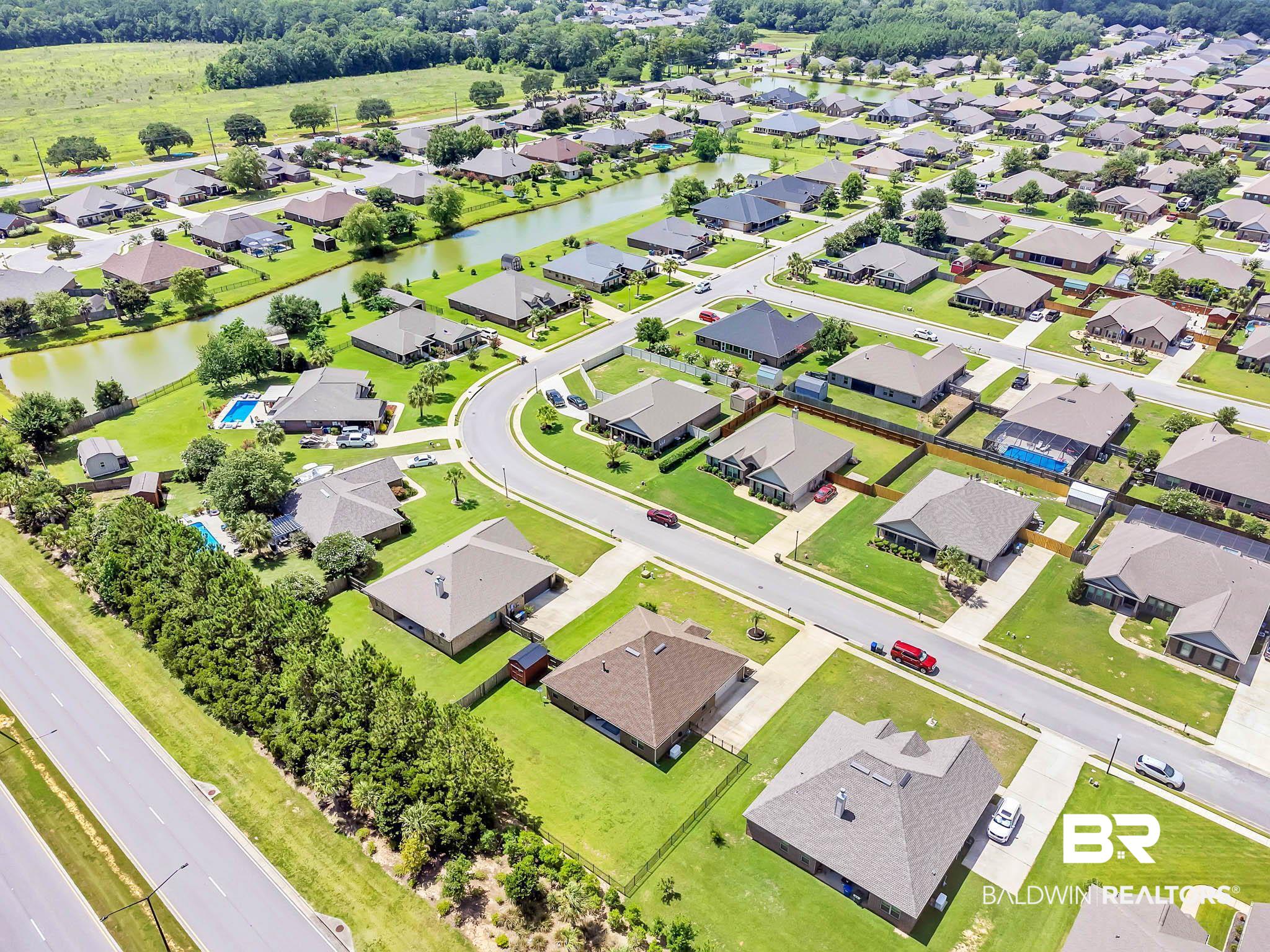 2049 Bourbon Street Foley, AL 36535 - Photo 51 of 56 Aerial view of residential area featuring a large body of water