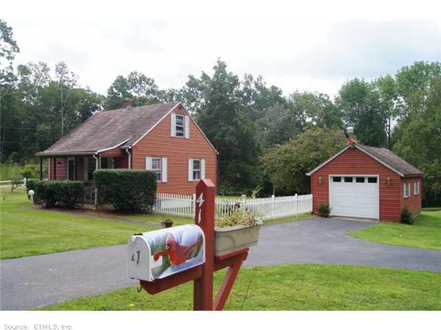 41 Robinson Hill Road Franklin, CT 06254 - Photo 1 of 1 a front view of a house with a yard and garage