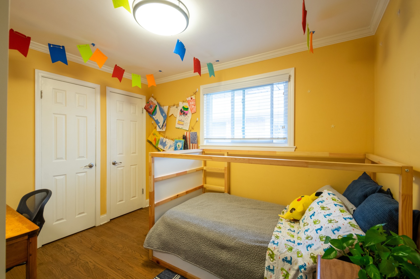 1315 Elliott Street Park Ridge, IL 60068 - Photo 7 of 10 a bedroom with a bed and a chandelier