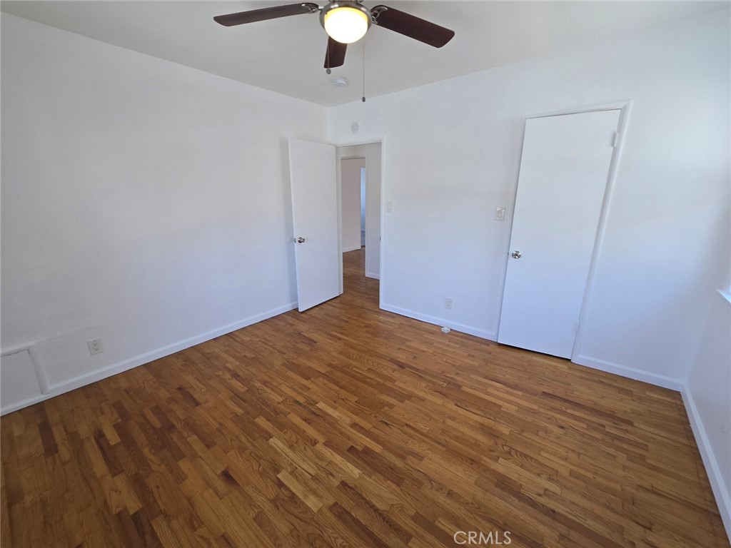 12503 Grevillea Avenue, Unit C Hawthorne, CA 90250 - Photo 11 of 13 a view of empty room with wooden floor