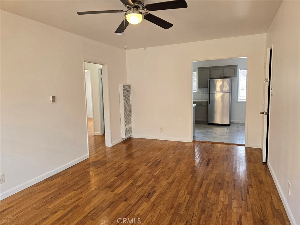 12503 Grevillea Avenue, Unit C Hawthorne, CA 90250 - Photo 2 of 13 wooden floor in an empty room with a window