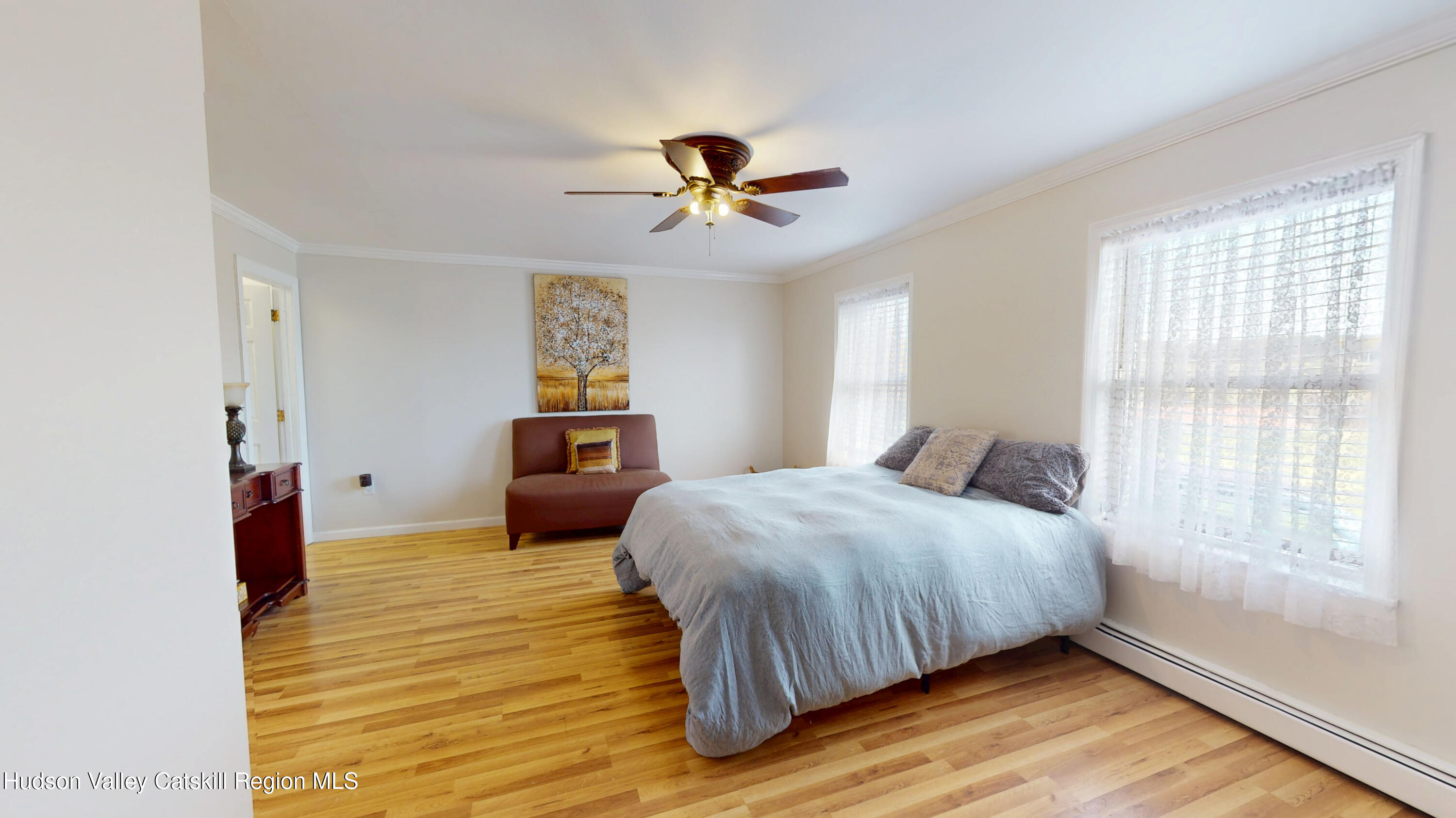 175 Jordan Road Coxsackie, NY 12051 - Photo 12 of 32 a bedroom with a bed and wooden floor