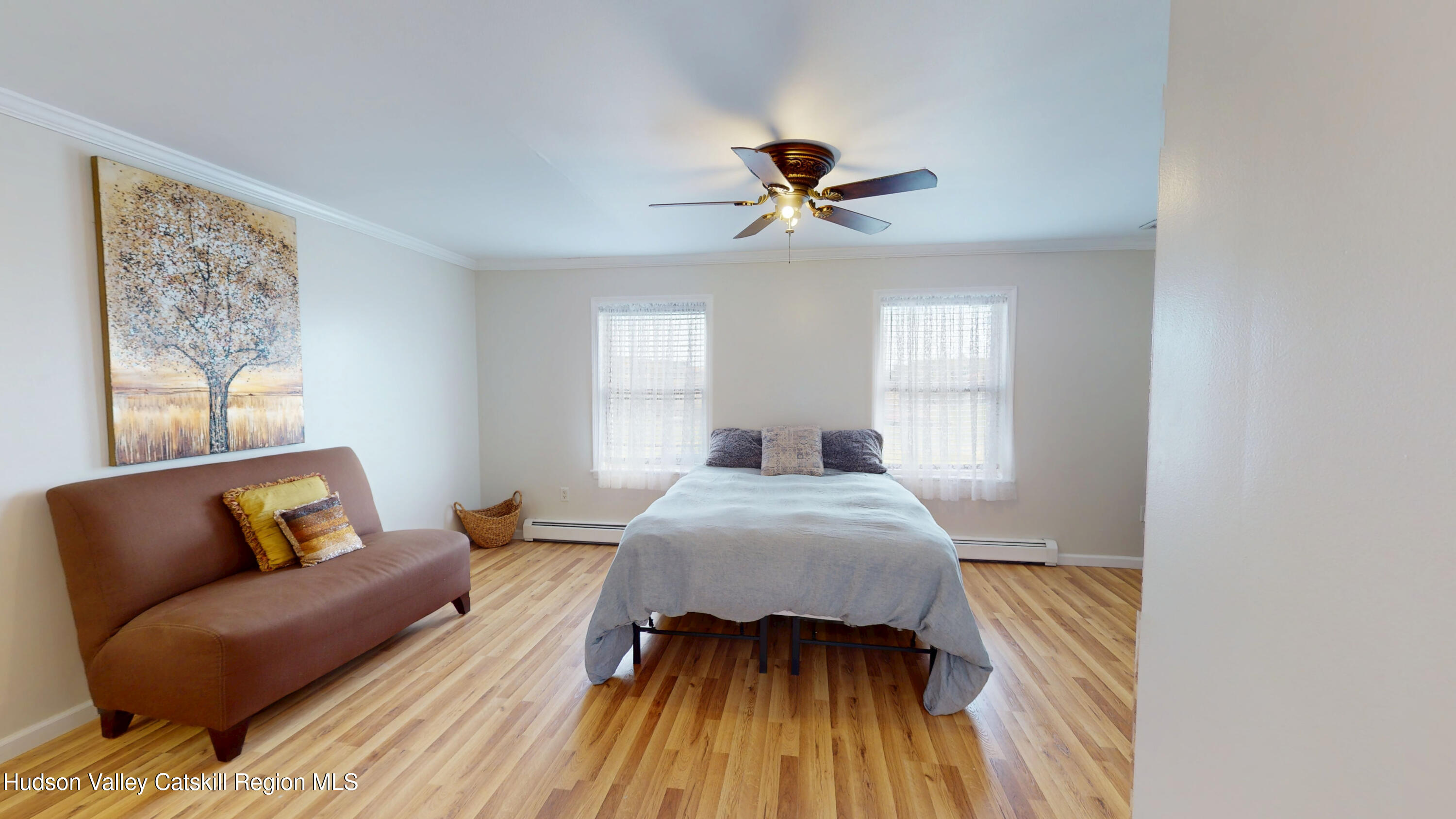 175 Jordan Road Coxsackie, NY 12051 - Photo 13 of 32 a bedroom with a bed and wooden floor